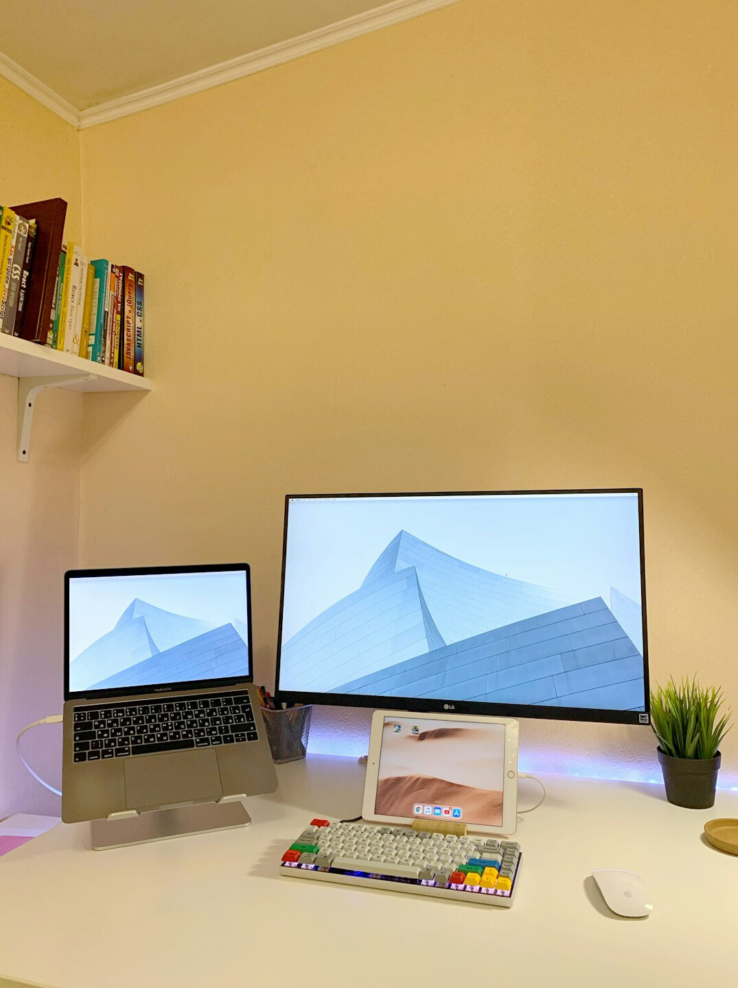Two monitors displaying source code in an editor